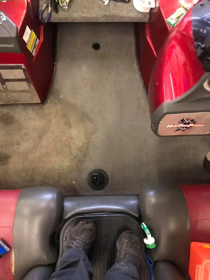 Rinsing bass boat carpet after Barbasol cleaning